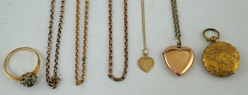 Three assorted yellow metal chains, one stamped 9ct, gross weight 11 grams, a 9ct heart shaped pendant and a small 9ct heart pendant, a yellow metal locket and a 9ct and gem set ring. Condition - poor